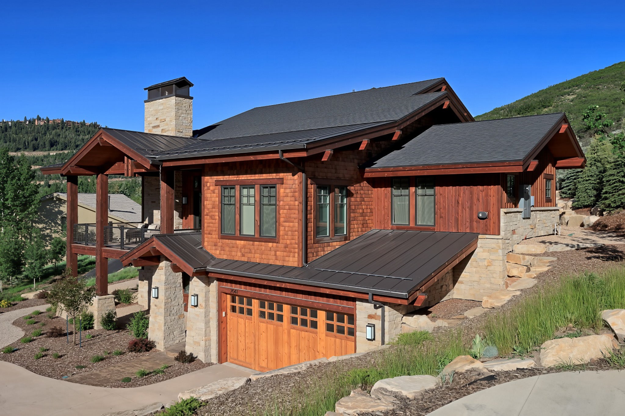 Mountain home with 1.5 inch mechanical lock standing seam metal roof panels in a dark bronze finish